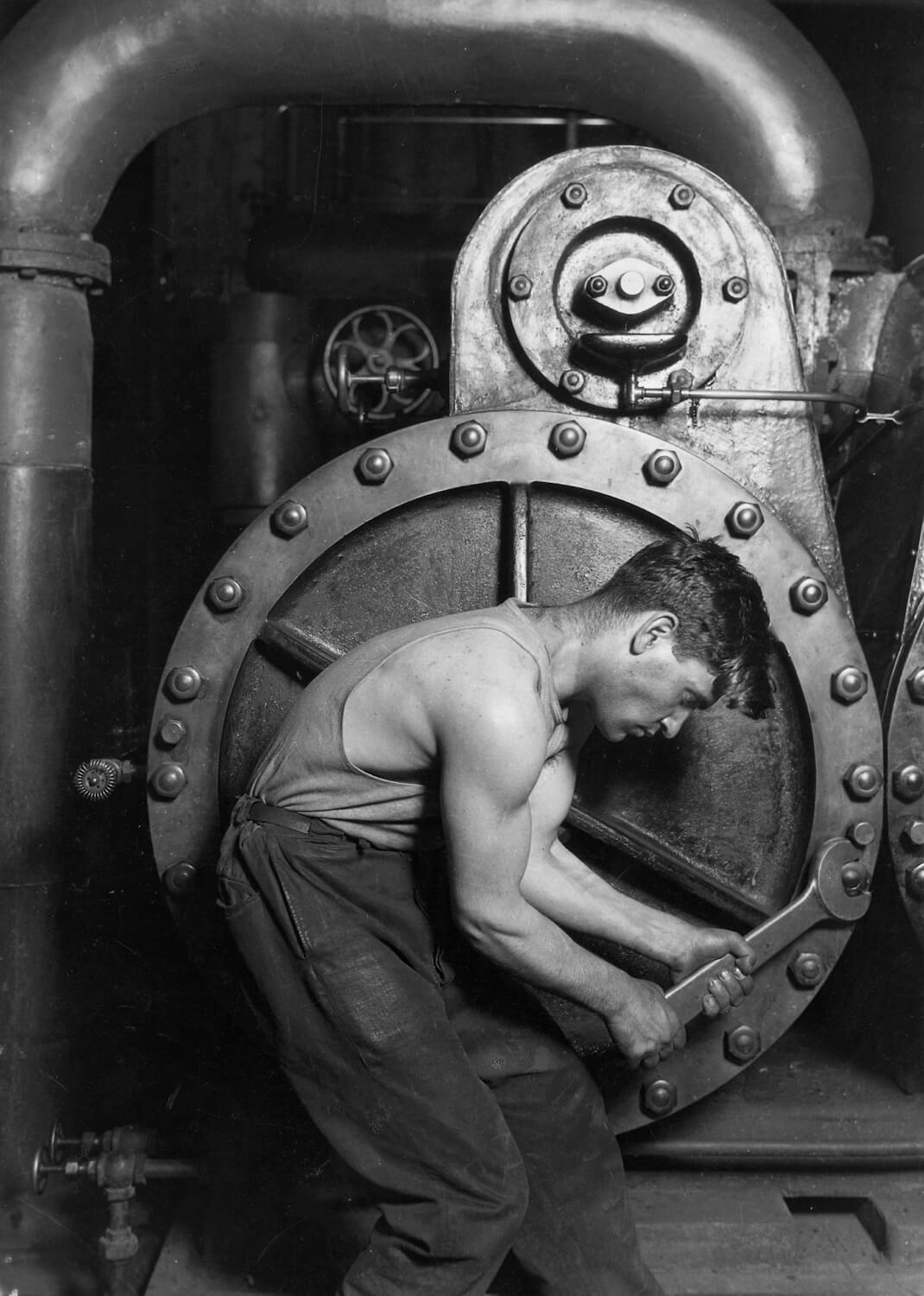 Lewis Wicks Hine, Powerhouse Mechanic Working on Steam Pump (1920)